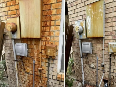 Close-up image showing brick rust removal process and cleaning results in Houston, TX