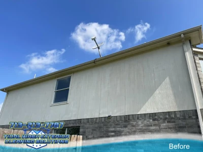 Second story siding of residential home with visible paint oxidation and fading exterior