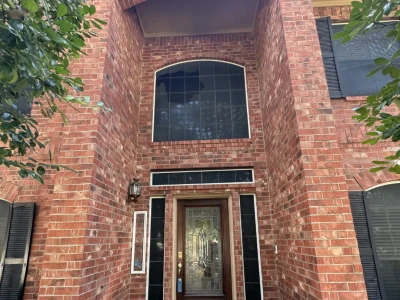 One-view photo of front entry walkway with brick and concrete cleaned in Pasadena TX