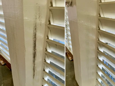 Side-by-side cleaning results on columns and privacy shutters at a Galveston beach house