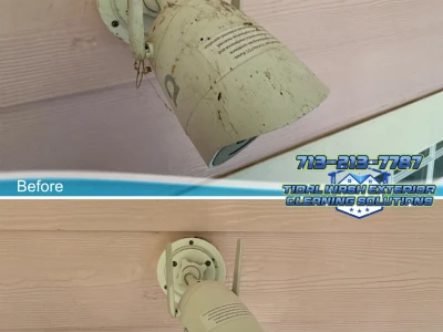 Before and after softwash around mounted security camera and adjacent siding in Galveston