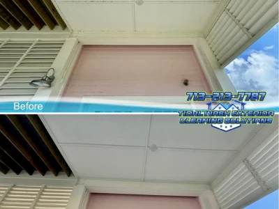 Before and after softwash of upper entry and Hardie ceiling on a Galveston coastal home