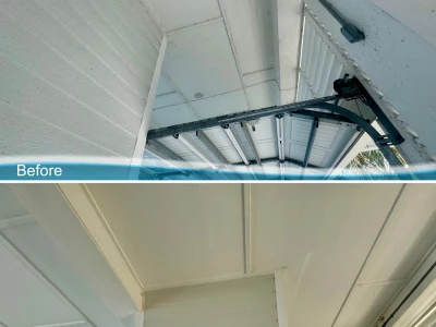 Before and after softwash of beach house patio Hardie board ceiling in Galveston